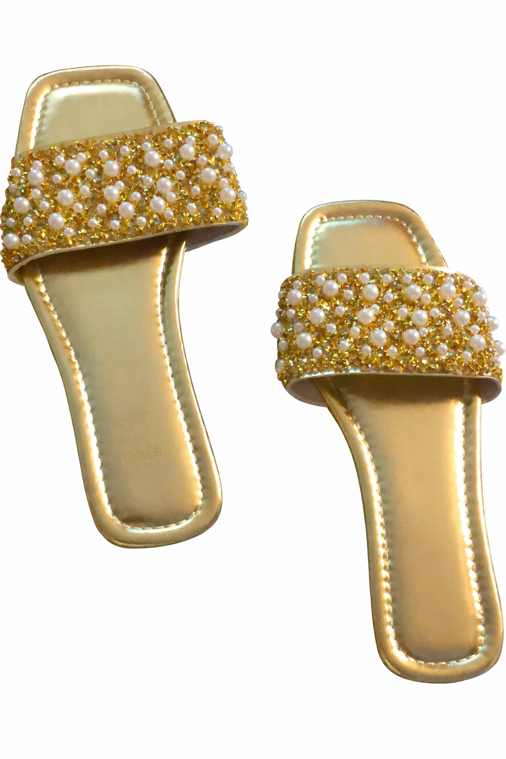 Golden sandals with pearl embellishments